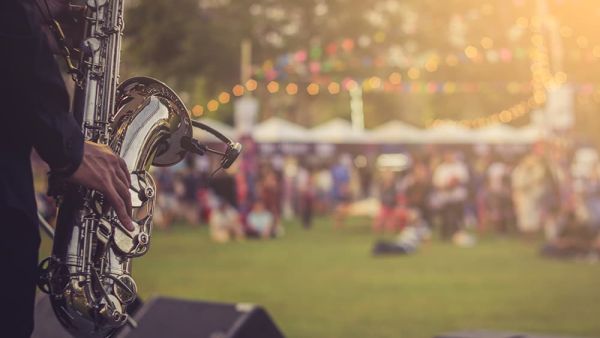 man with saxophone at outdoor festival prevent chargebacks and fraud