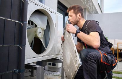 HVAC contractor reparing air conditioning system