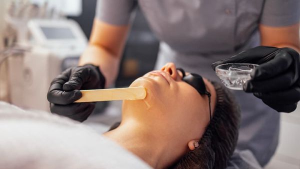 beautician working with woman