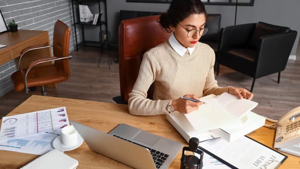 Female notary public working in office