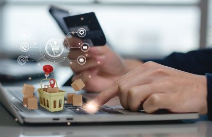 Man on computer payment credit card transaction