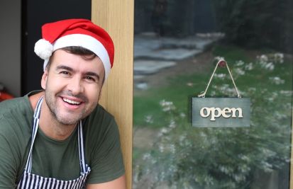 employee in front of store