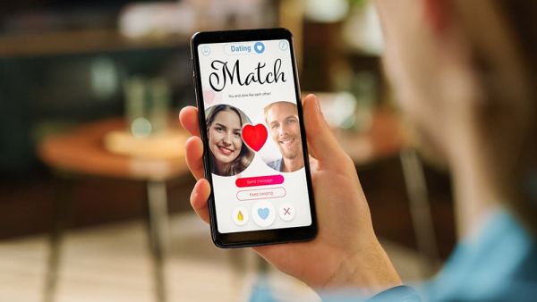 Woman looking at dating phone app with a match