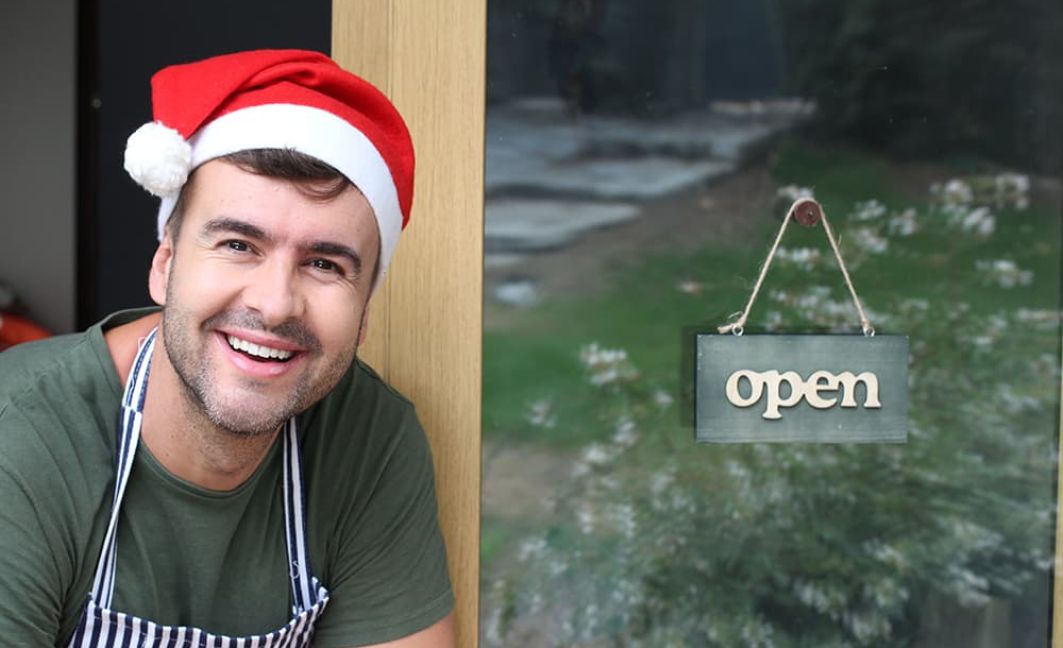 employee in front of store