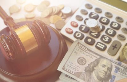 gavel with calculator and money currency