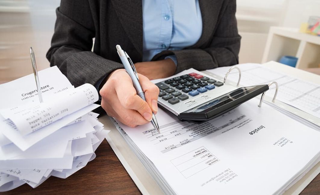 Woman with a lot of invoices