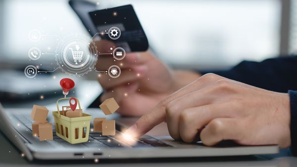 Man on computer payment credit card transaction