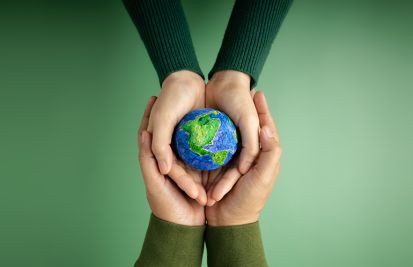 earth day with globe in palm of hands