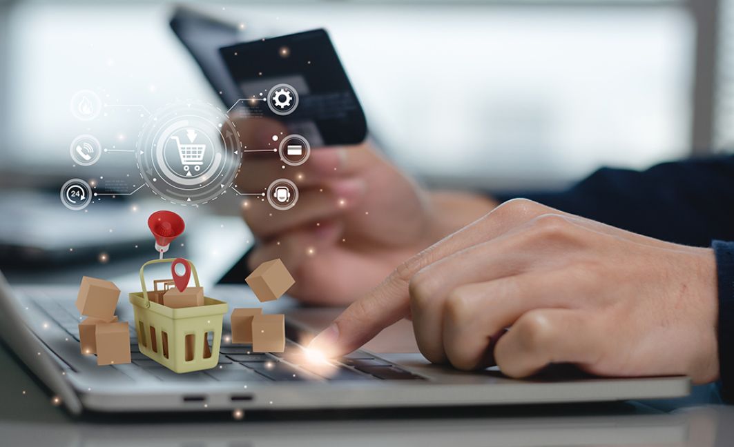 Man on computer payment credit card transaction