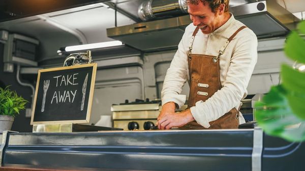 food truck owner making order