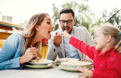 family celebrating mothers day at restaurant