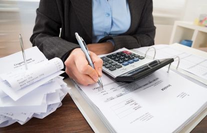 Woman with a lot of invoices