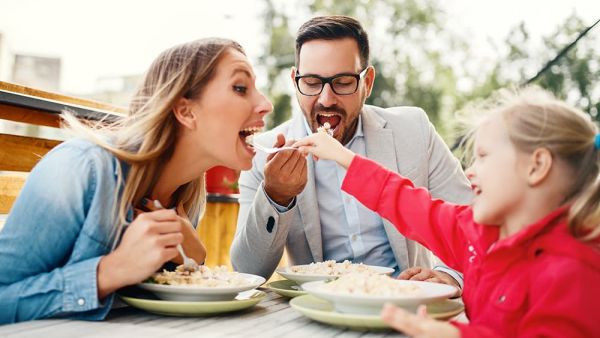 family celebrating mothers day at restaurant