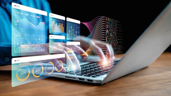 Man on laptop using innovation to be more efficient for business