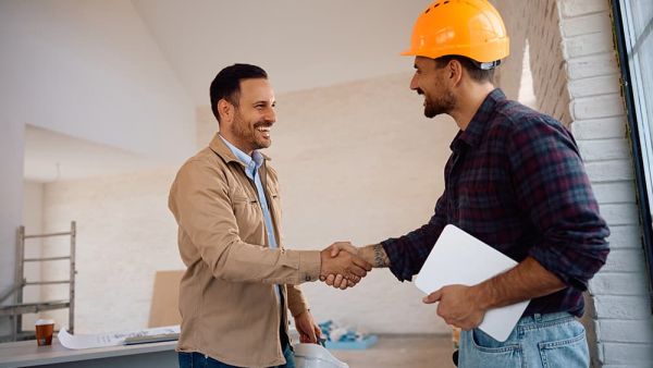 man shaking hands with home contractor