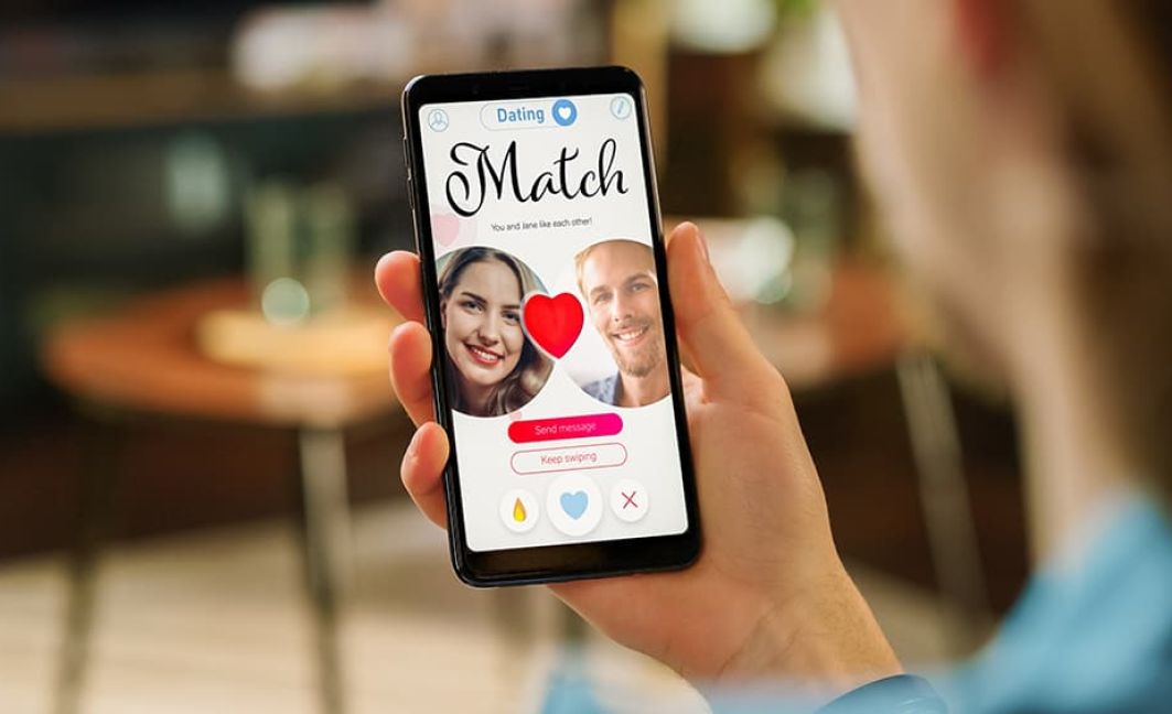 Woman looking at dating phone app with a match