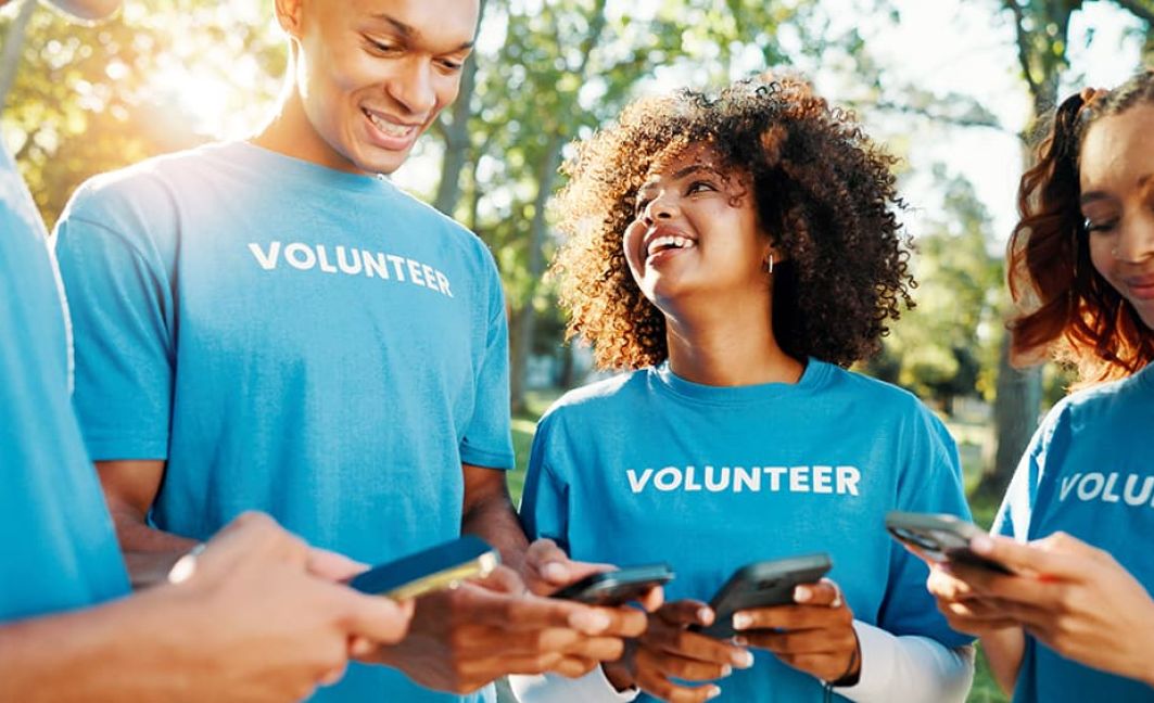 volunteers using mobile terminals and fundraising