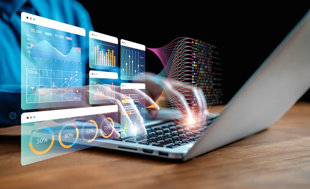 Man on laptop using innovation to be more efficient for business