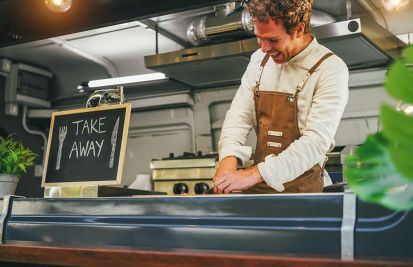 food truck owner making order