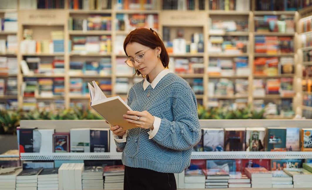 woman standing in bookstore