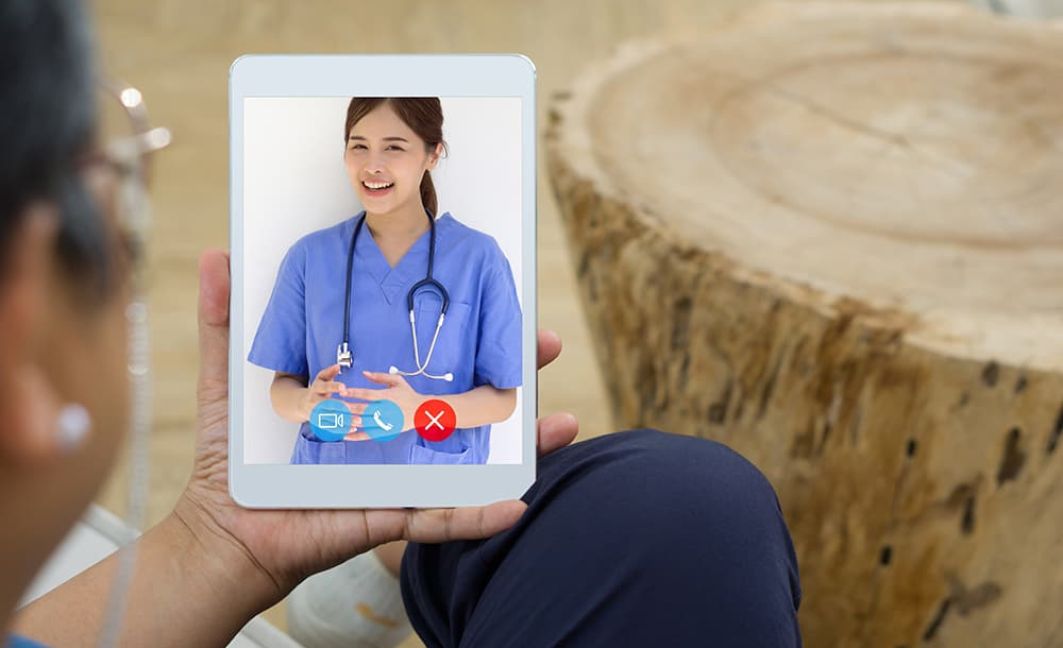 patient on a telehealth call with a female provider