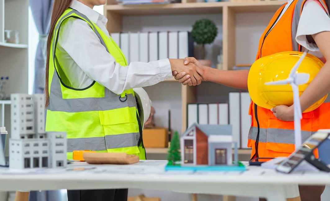 contractor shaking hands for phased billing