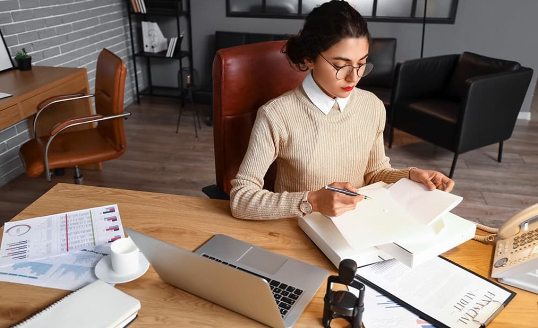 Female notary public working in office