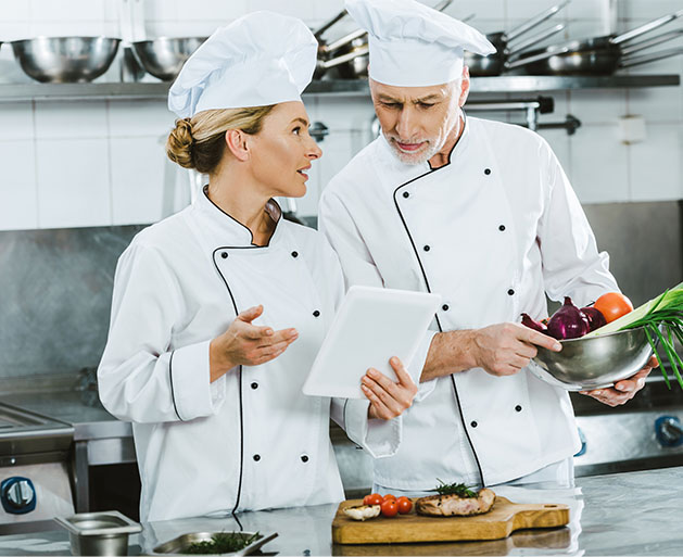 Chefs at a fine dining restaurant using North POS systems to manage their inventory