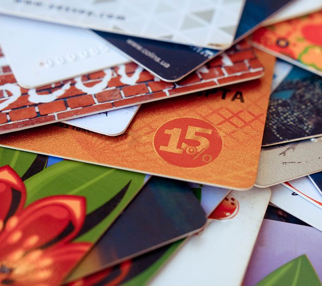 A stacked of customized gift cards made using North's POS services