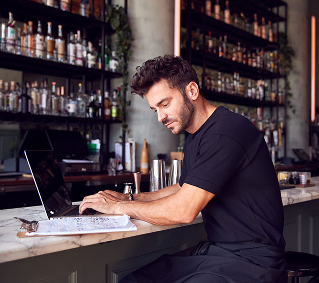 A business owner accessing his sales report with North's merchant portal