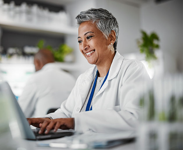 A pharmacist looking at how secure her online portal is thanks to North's POS systems 