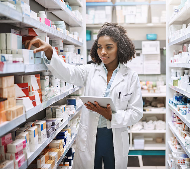 A pharmacist taking stock using North's inventory management systems 